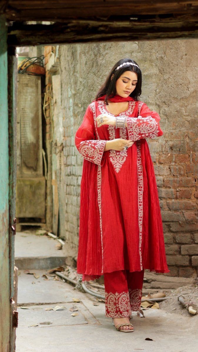 Red ensemble — heritage backdrop